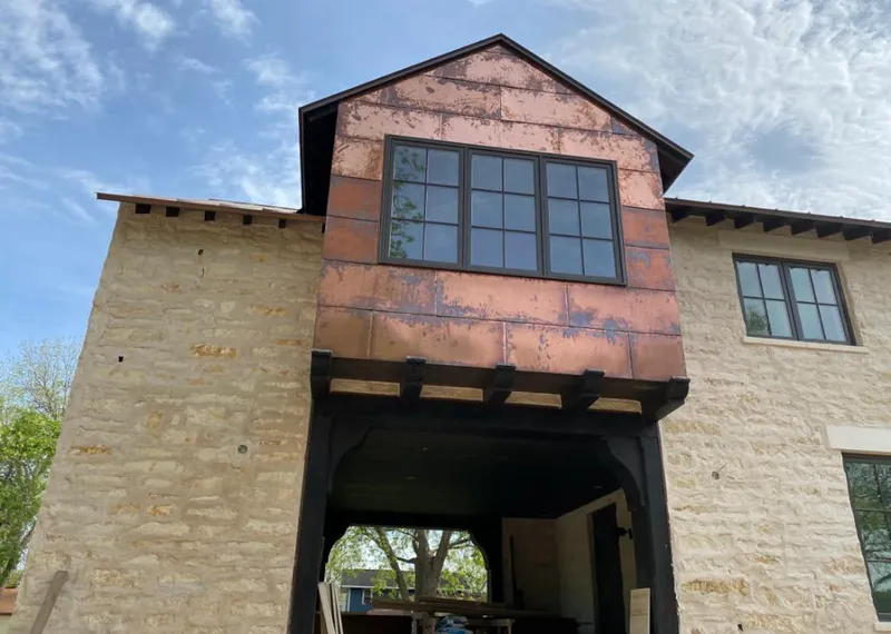 Copper metal panel facade on a stone building for Skylight Installation in Pahrump